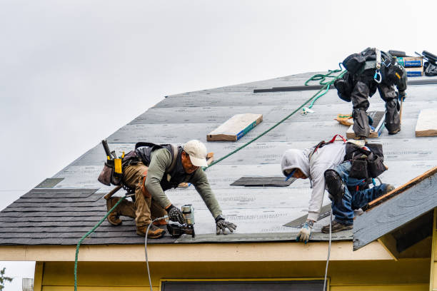 Professional Gutter Installation technician working in Pescadero, CA